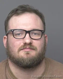 Mugshot of CALEB TYLER SCOTT OLSON booked in Dubuque County, Iowa on March 30, 2026