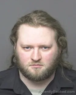 Mugshot of EVAN RICHARD SCHMITT booked in Dubuque County, Iowa on March 30, 2026