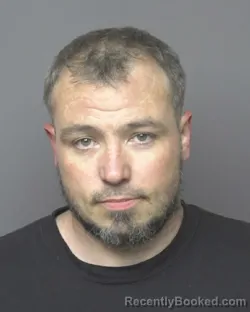 Mugshot of MICHAEL WESLEY MACINNIS booked in Dubuque County, Iowa on April 1, 2026