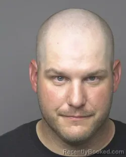 Mugshot of SAMUEL LATHAM KENNIKER booked in Dubuque County, Iowa on June 20, 2026
